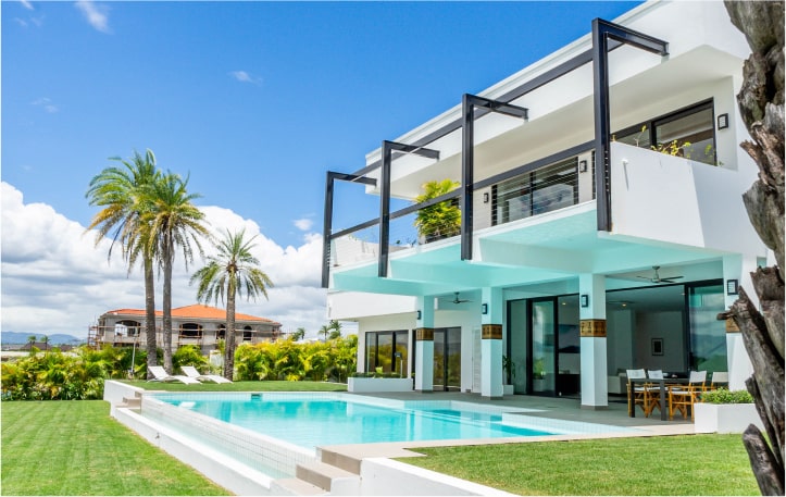 house with blue swimming pool palm trees